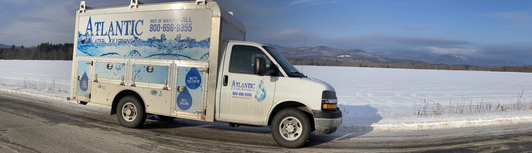 Atlantic Water service van on a snowy field