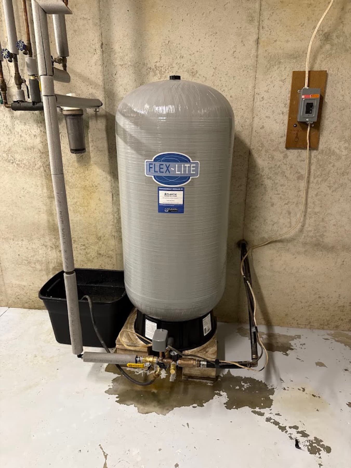 Pressure tank and well pump in a basement